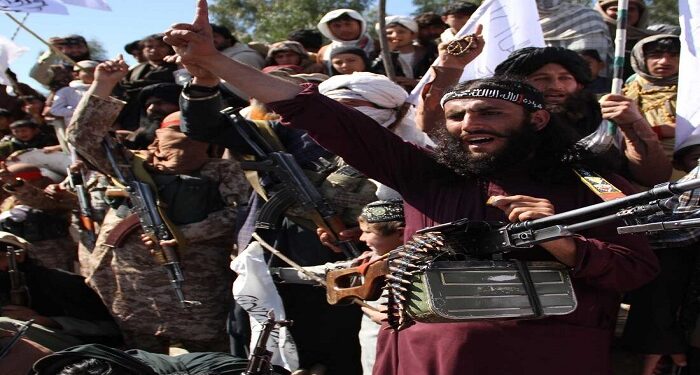 Afghan Taliban fighters and villagers attend a gathering as they celebrate the peace deal signed between US and Taliban in Laghman Province, Alingar district on March 2, 2020. The agreement was signed in Doha, Qatar, by US Special Representative for Afghanistan Reconciliation Zalmay Khalilzad -- the chief US negotiator in the talks with the Taliban -- and Mullah Abdul Ghani Baradar -- the Taliban's chief negotiator. Secretary of State Mike Pompeo witnessed the signing. (Photo by Wali Sabawoon/NurPhoto via Getty Images) (Photo by Wali Sabawoon/NurPhoto via Getty Images)