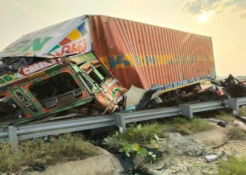 Four killed in car and container collision