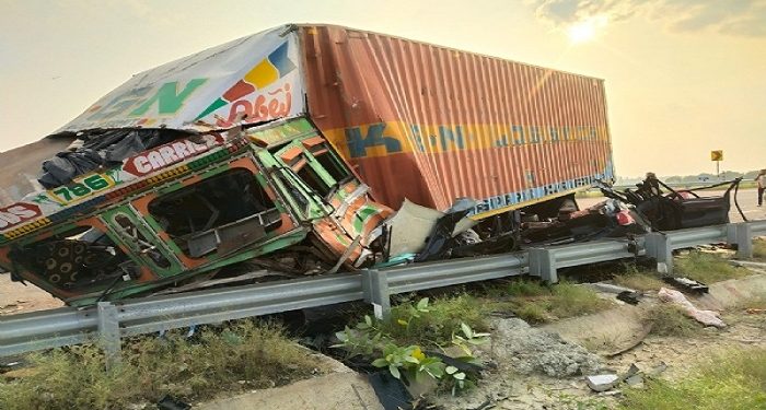 Four killed in car and container collision