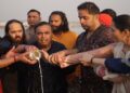 Mukesh Ambani and family take holy dip in Sangam