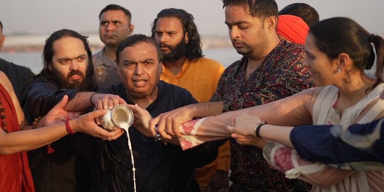 Mukesh Ambani and family take holy dip in Sangam