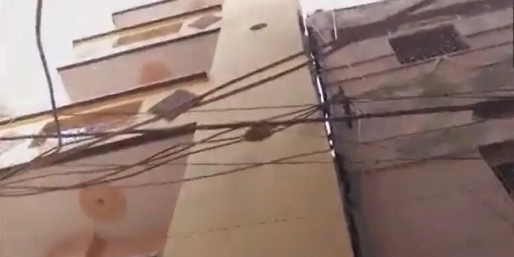 Panic due to tilting of four storey building