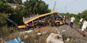 School bus and train collide