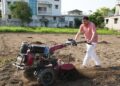 CM Dhami operated the tiller in the field