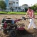 CM Dhami operated the tiller in the field