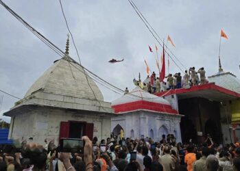 Flowers showered on Shiva devotees at Lodheshwar Mahadeva.