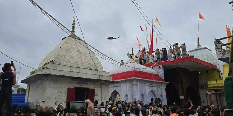 Flowers showered on Shiva devotees at Lodheshwar Mahadeva.