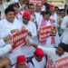 SP MLA staging a sit-in protest