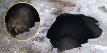 road caves in near IT Crossing.